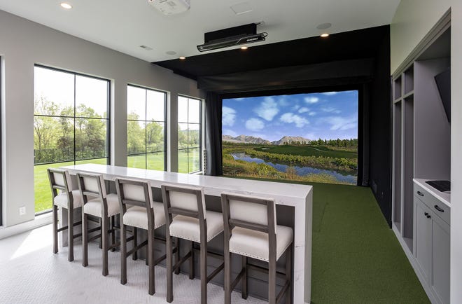 This stunning five-bedroom house in West Des Moines features a two-story great room, elegant dining room and serene and spa-like bathroom.