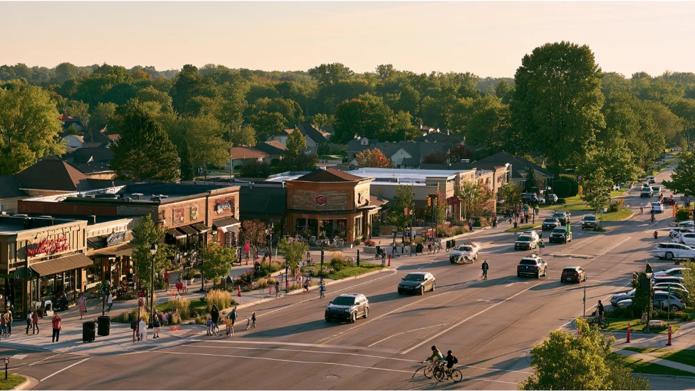 People enjoying an everyday suburban setting in Okemos, Michigan near local shops, restaurants, and residential neighborhoods.