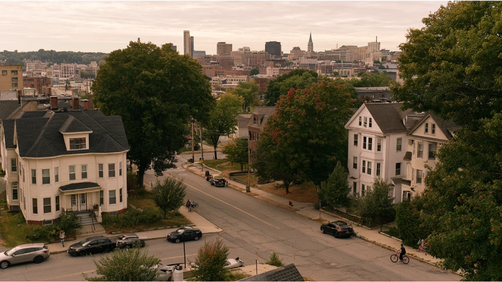 Worcester Massachusetts cityscape with historic neighborhoods, downtown buildings, and everyday city life