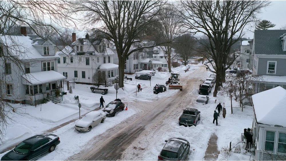 Snow-covered residential street in Marlborough Massachusetts during winter
