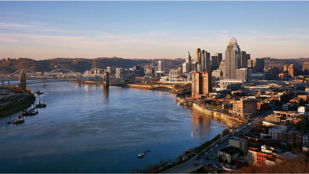 Cincinnati's downtown skyline and Roebling Suspension Bridge connecting Ohio with Northern Kentucky across the Ohio River.
