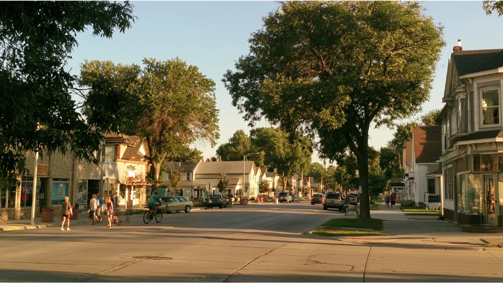 People enjoying an ordinary day in Fremont, Nebraska, near local shops, residential streets, and community spaces.