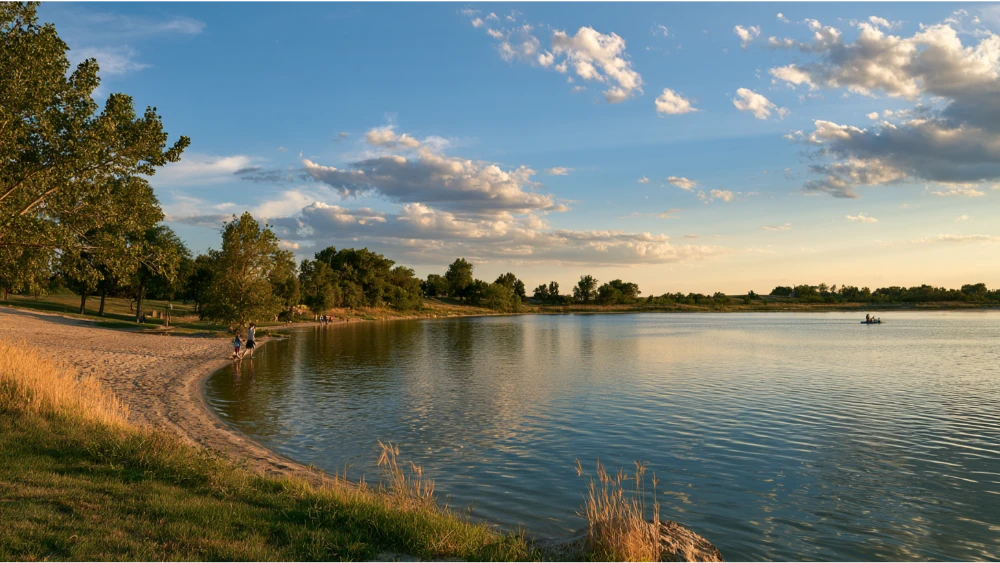 Visitors enjoying the lakes and shoreline near Fremont, Nebraska, with open water, trees, and a peaceful Central Nebraska landscape.