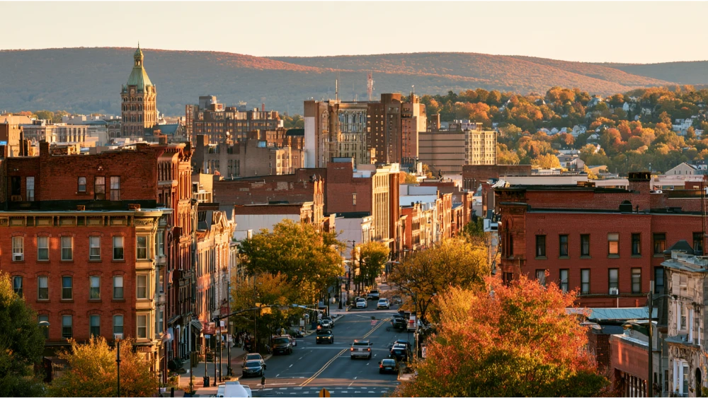 Scranton, Pennsylvania, downtown streets with historic brick buildings and the surrounding wooded hills of northeastern Pennsylvania.
