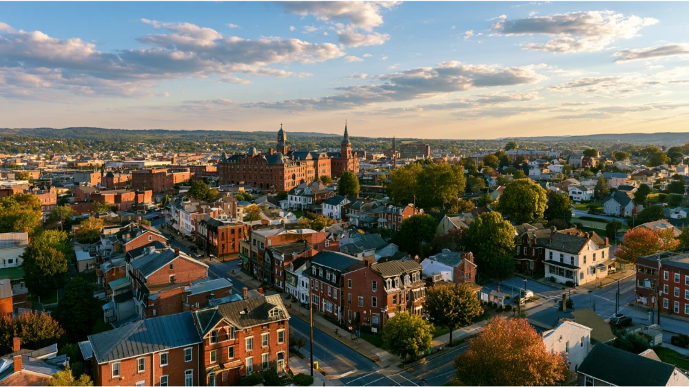 A York, Pennsylvania, neighborhood showing historic brick buildings, residential streets, and nearby suburban-style homes.