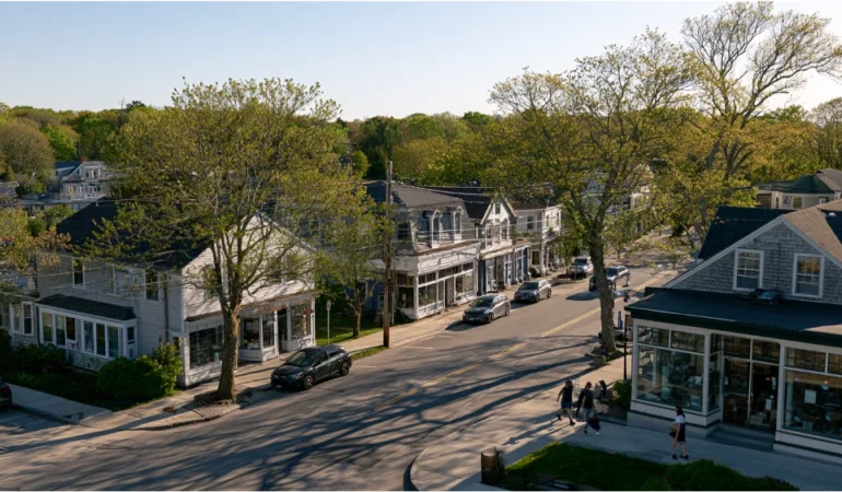 A scenic view of South Kingstown, Rhode Island, featuring a traditional New England village, tree-lined streets, and coastal scenery.