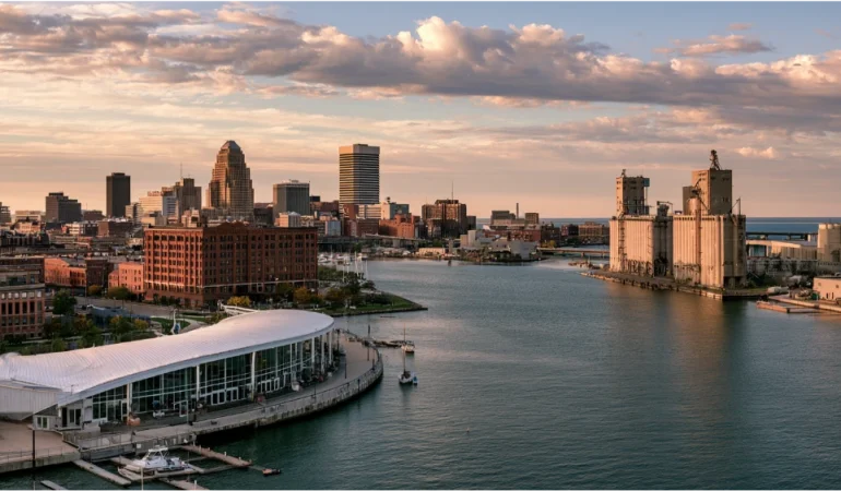 Visitors enjoying Buffalo's Canalside waterfront, with historic grain elevators, recreational activities, and the city's distinctive lakeside urban scenery.