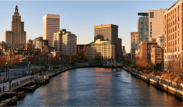 Downtown Providence, Rhode Island, skyline along the Providence River with historic buildings, city streets, and waterfront views.