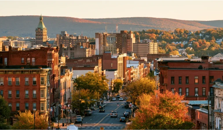 Scranton, Pennsylvania, downtown streets with historic brick buildings and the surrounding wooded hills of northeastern Pennsylvania.