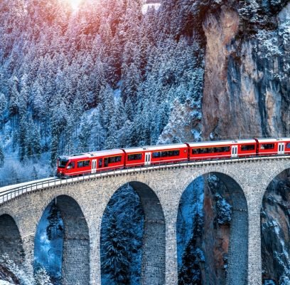 Aerial,View,Of,Train,Passing,Through,Famous,Mountain,In,Filisur,