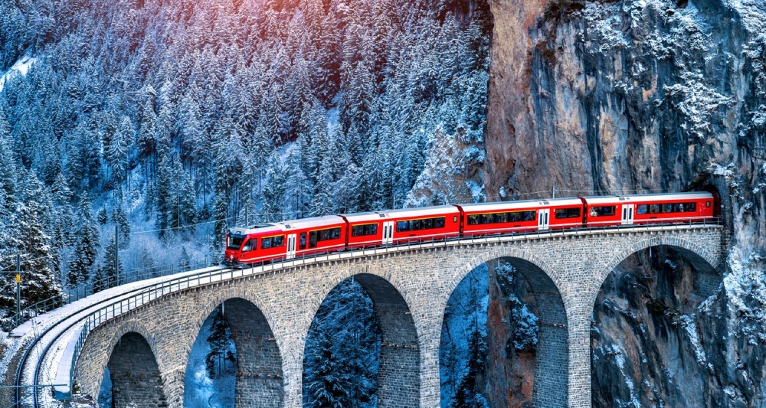 Aerial,View,Of,Train,Passing,Through,Famous,Mountain,In,Filisur,