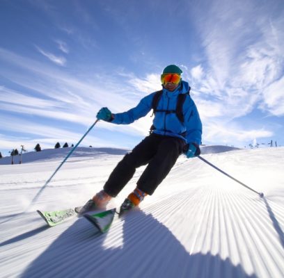 Professional,Skier,Skiing,On,Slopes,In,The,Swiss,Alps,Towards